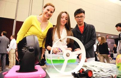 Morgan Danyi (in yellow) and her Design Day team overcame technical hurdles to create a working bubble-blowing machine.