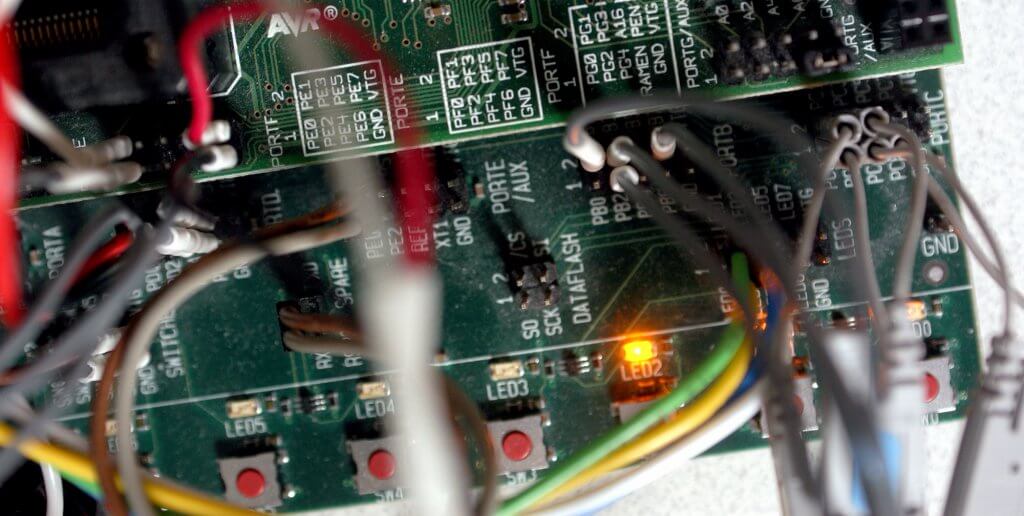 A close-up of an embedded circuit board with wiring