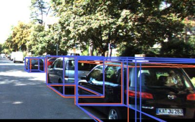 photo shows cars on a street, with each of them surrounded by lines indicating a bounding box