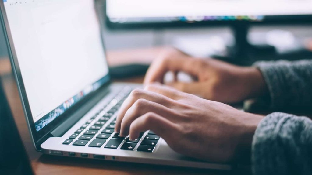 purely decorative image of hands typing